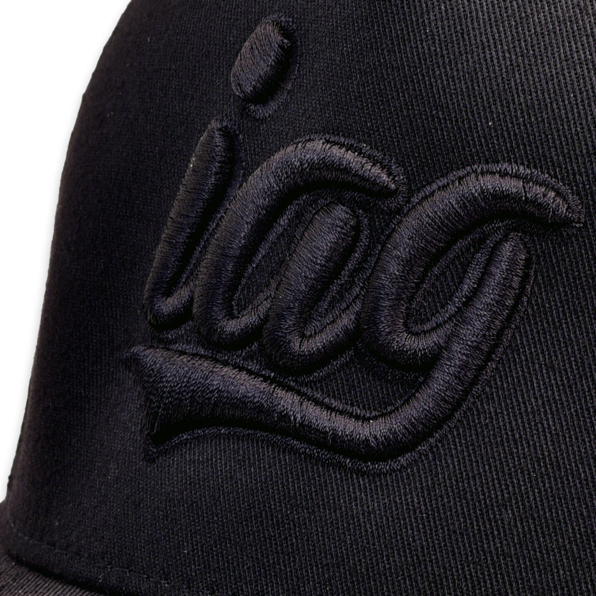 IAG Performance Flexfit Cap with Black Script Logo - Close-up